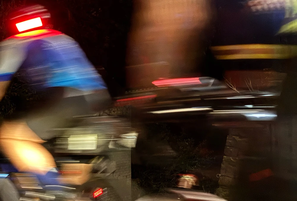 Audax rider in motion at night